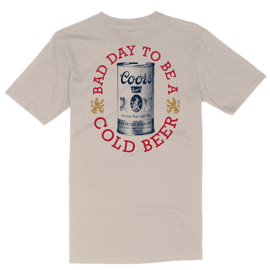 Beige t-shirt with a Coors beer can design and text printed on it.