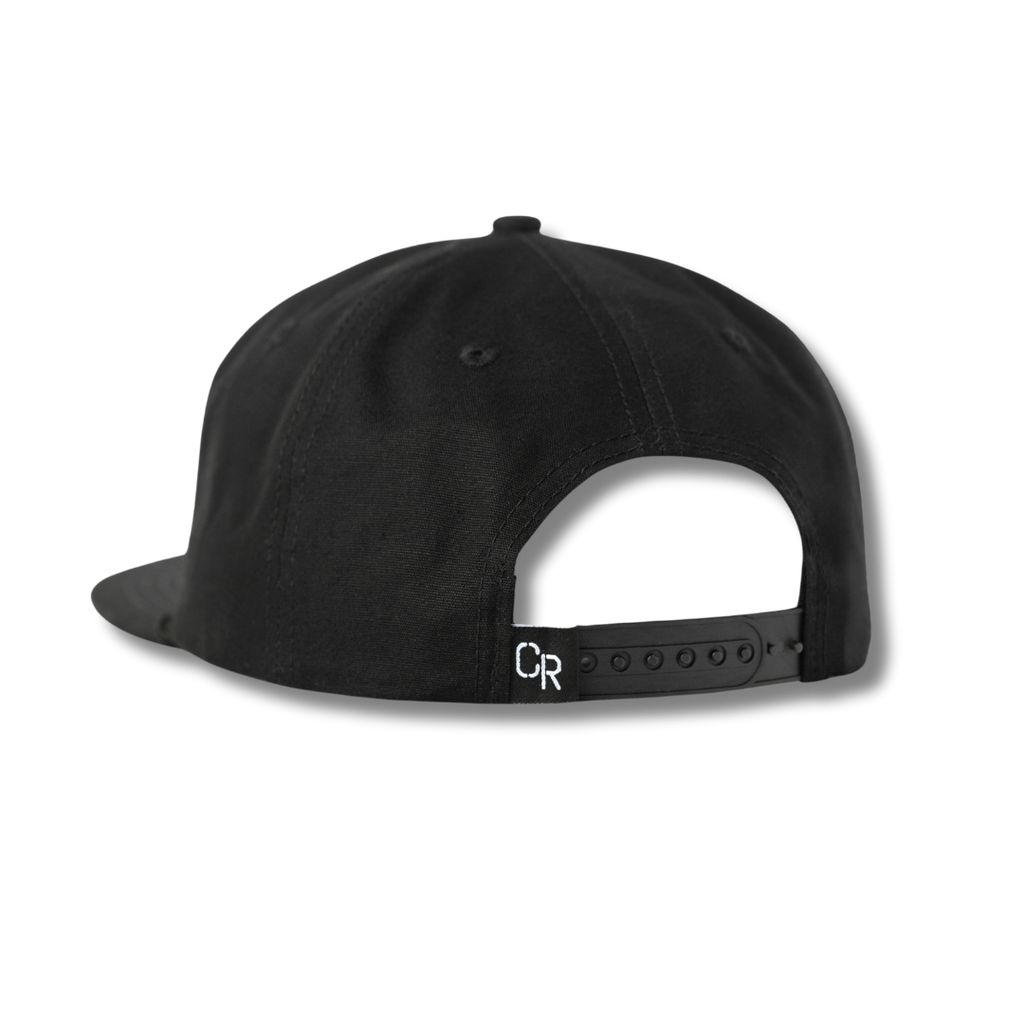 Black snapback cap with an adjustable strap.